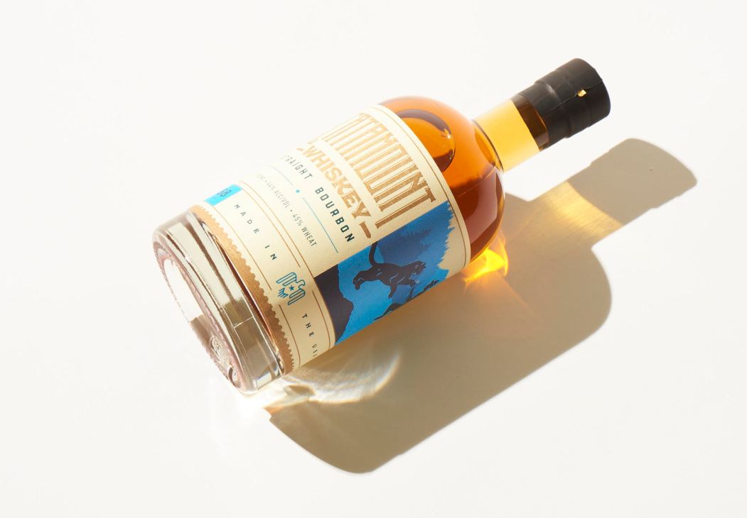 Catamount bourbon by Grand Teton Distillery with label featuring blue cougar illustration.