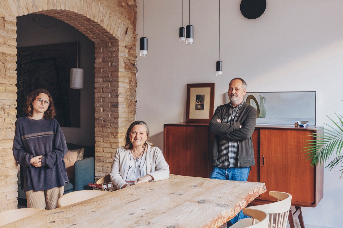 Three family members, Maria Mira Garcia, Elena Garcia Testal and Javier Mira Benavent, posing together in their home interior