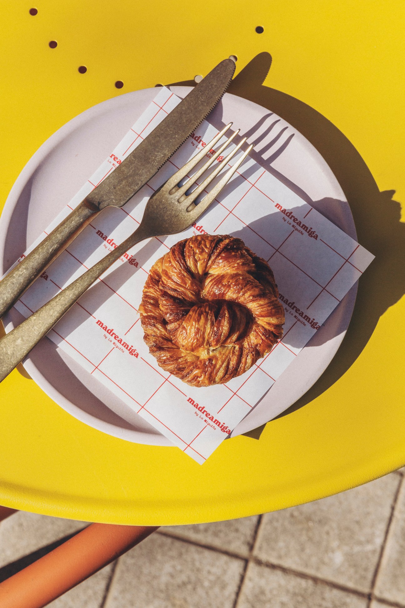 Golden glazed cinnamon roll pastry from Madreamiga bakery