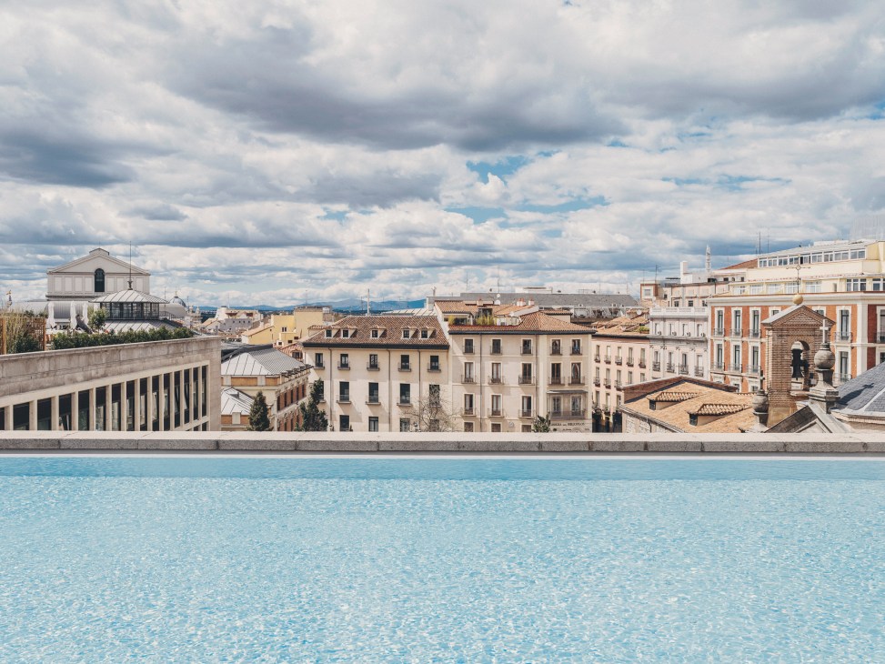 Large rooftop swimming pool at The Madrid Edition with city views