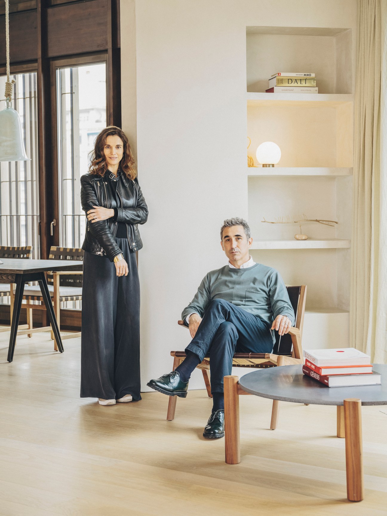 Paloma Hernaiz and Jaime Oliver of Ohlab in modern apartment interior with built-in shelving