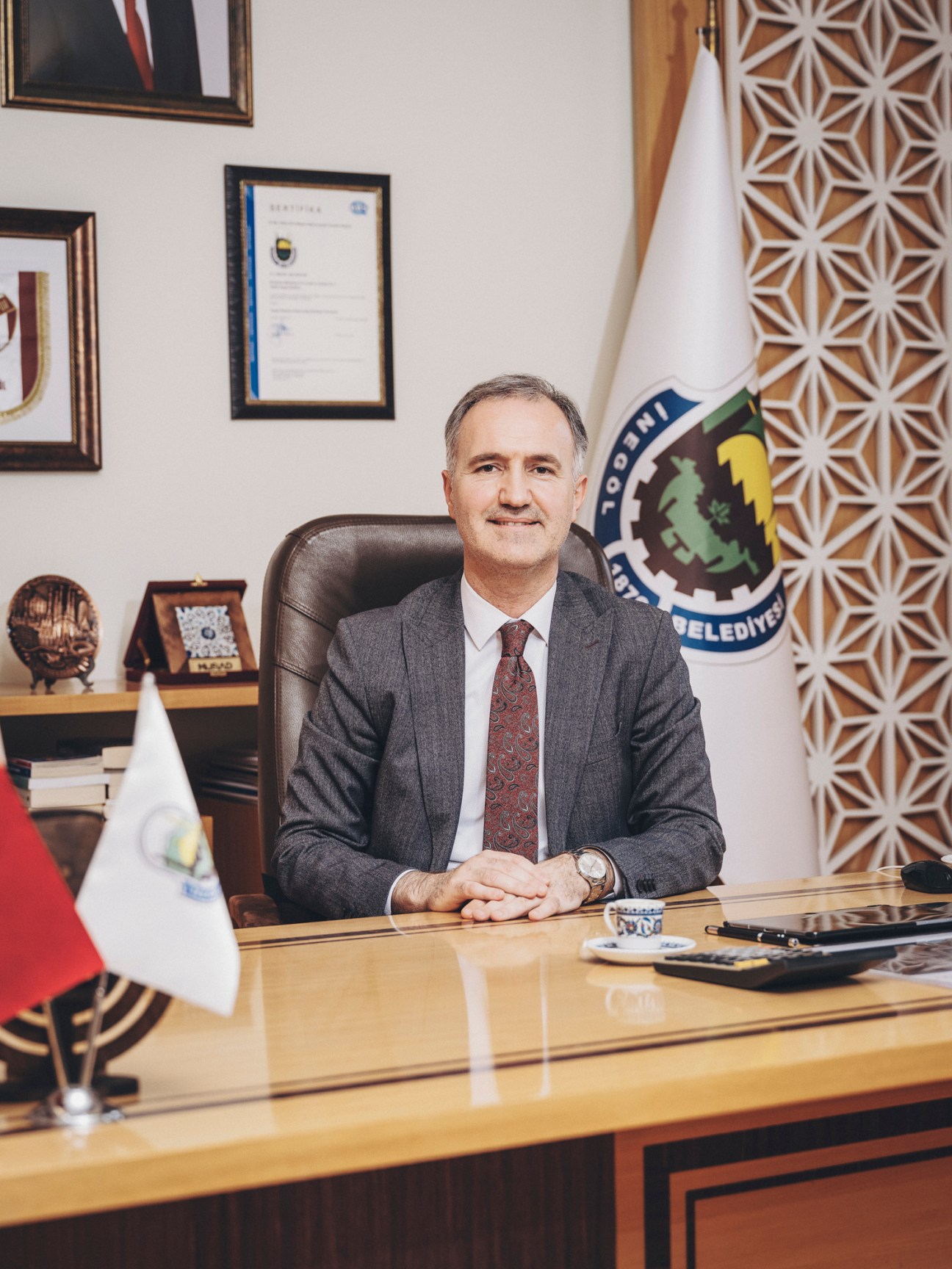 Mayor Alper Taban sitting at his desk in his office
