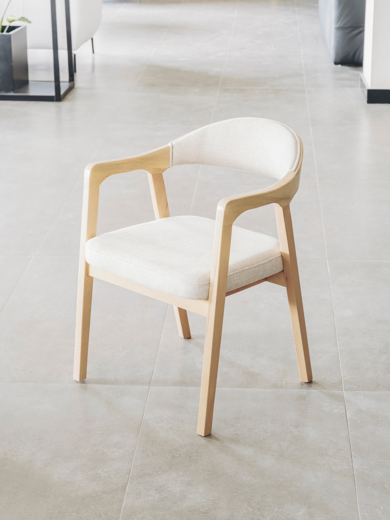 Modern wooden dining chair with cream upholstery designed by N Design