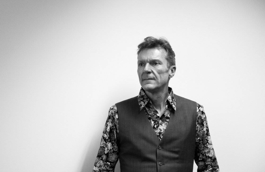 Portrait of Bruno Maag, typesetter and founder of Dalton Maag font foundry, wearing a patterned shirt and vest.