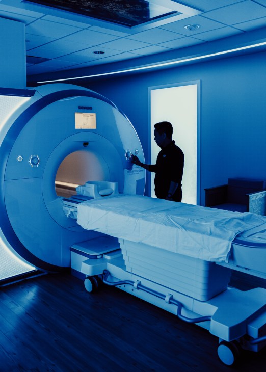 A technician operates a Siemens MRI machine at Health Nucleus medical clinic in San Diego.