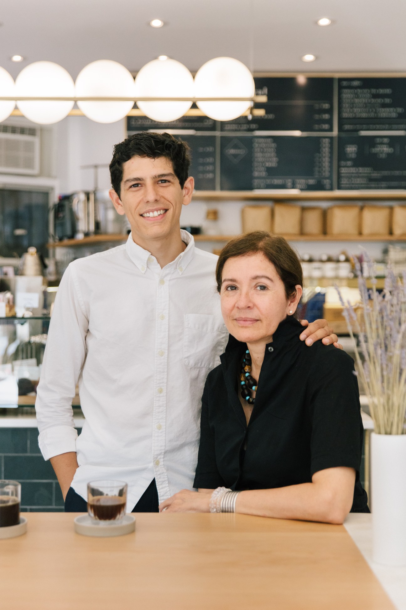 César Vega and his mother Helvia in their minimalist Café Integral coffee shop in New York's Nolita neighborhood.