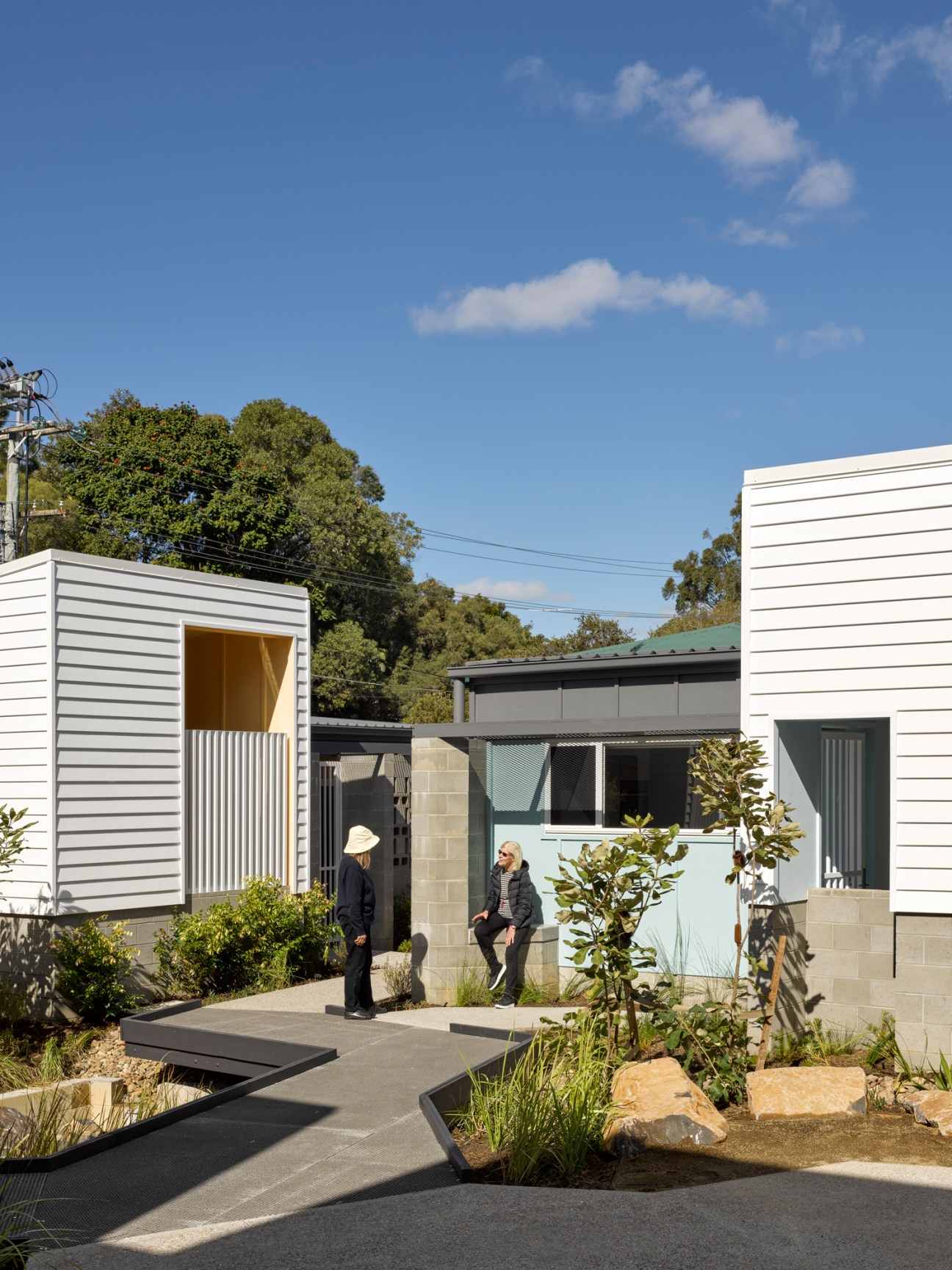 Community garden spaces at Anne Street Garden Villas demonstrating integration of landscape design with social housing