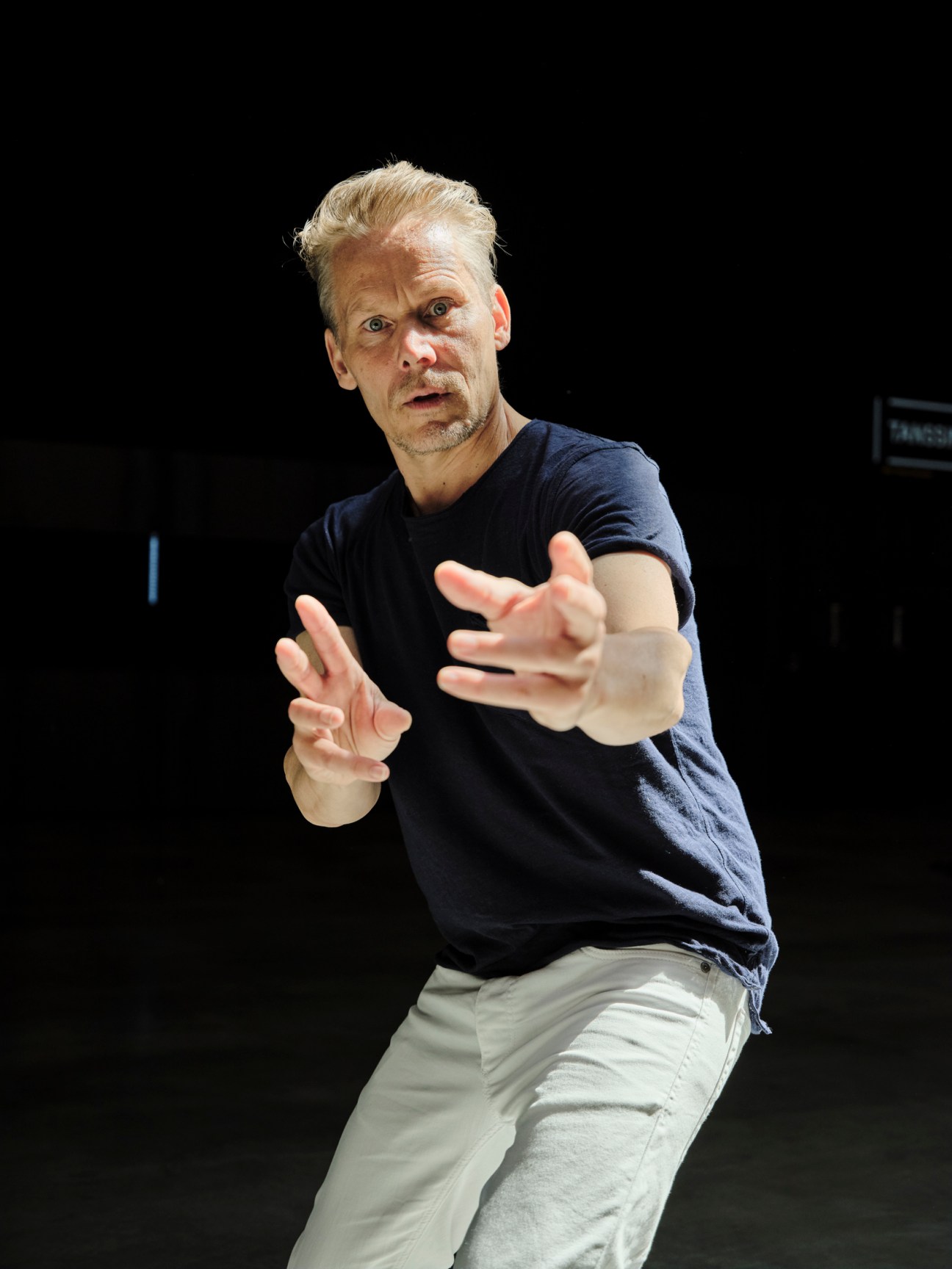 Tero Saarinen, Finnish dancer and choreographer, performing expressive hand gestures during rehearsal