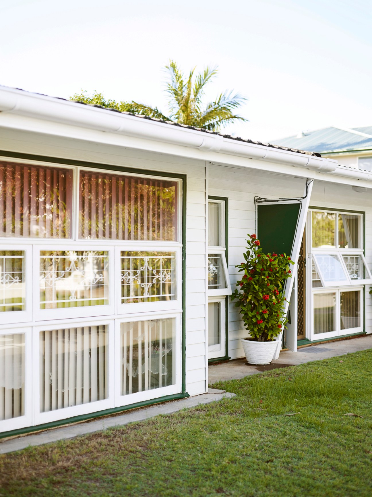 1960s Australian coastal home with wide opening windows and cantilevered roof designed to maximize natural airflow and cooling