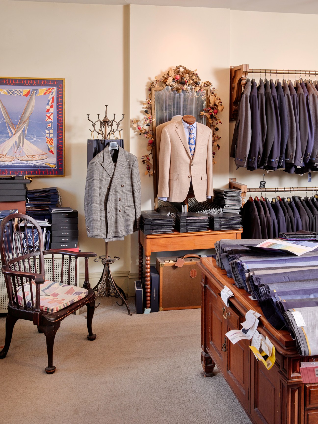 Cuffs boutique interior displaying menswear on mannequins and organized racks with vintage furniture and artwork.