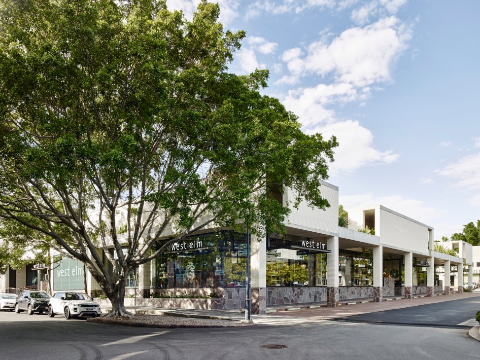 Open-air shopping arcade in Brisbane's James Street precinct with natural ventilation and overhanging shade features