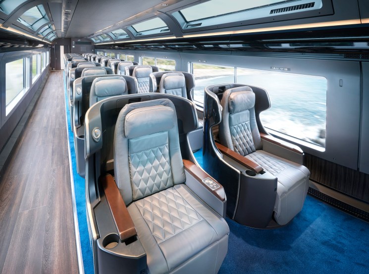 Premium Green carriage interior with quilted leather seats and large panoramic windows