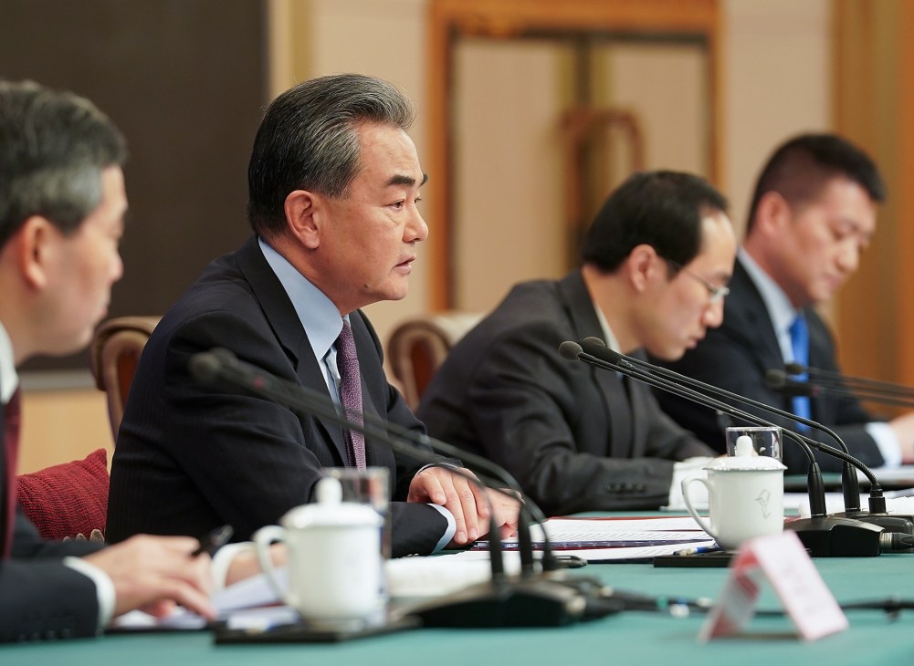 Chinese diplomats in formal meeting setting