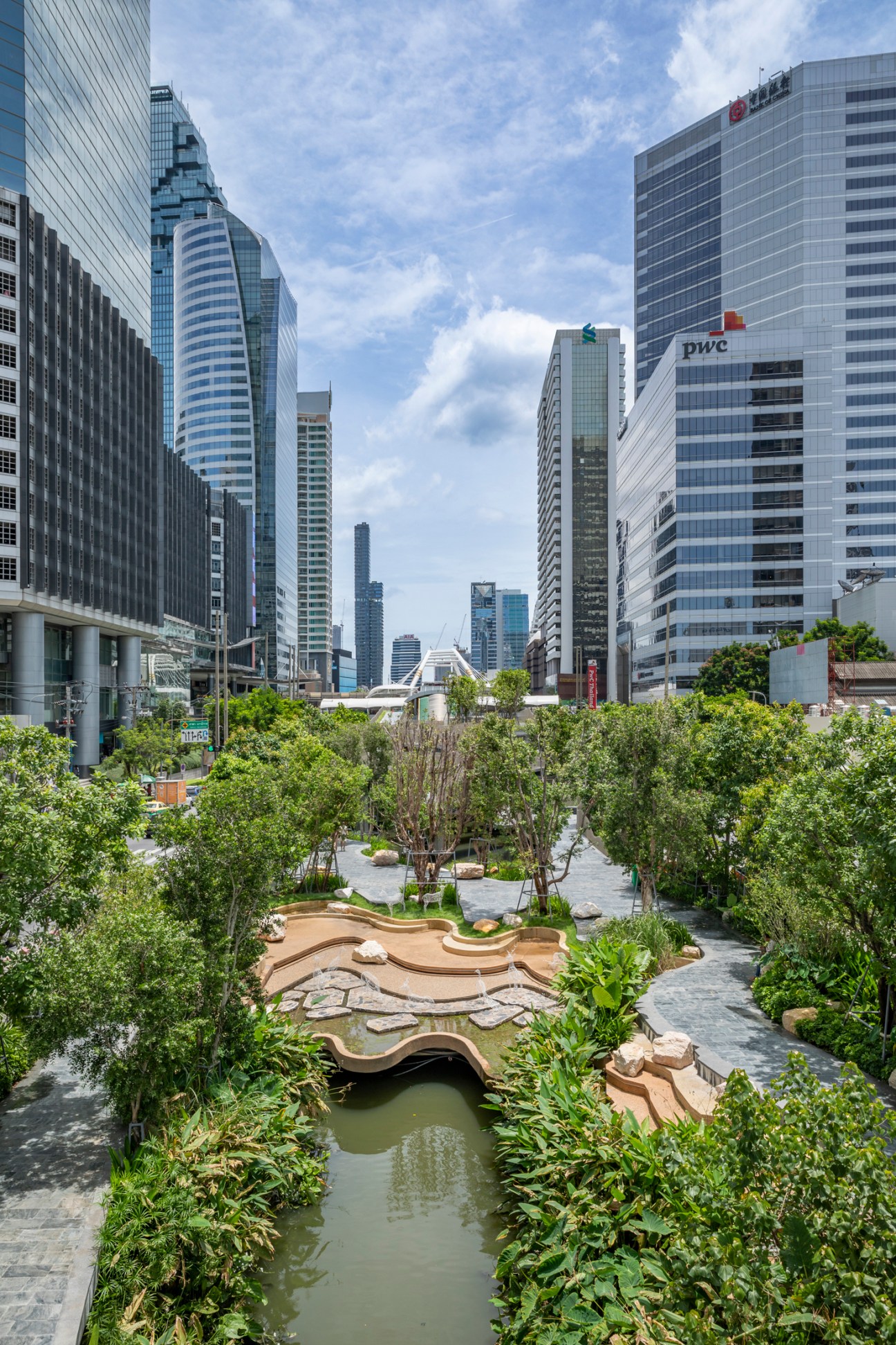 Aerial view of Chong Nonsi Canal Park showing linear green space along waterway through urban Bangkok