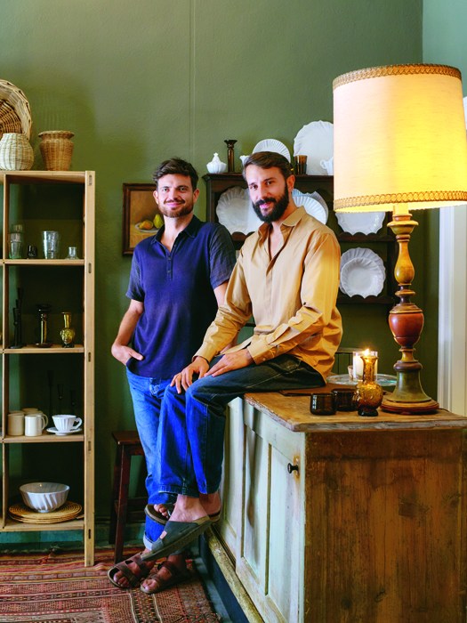Portrait of Ryan Weimer and Nicola Pozzi, founders of Vicolo Via Mameli, standing in their Milan shop