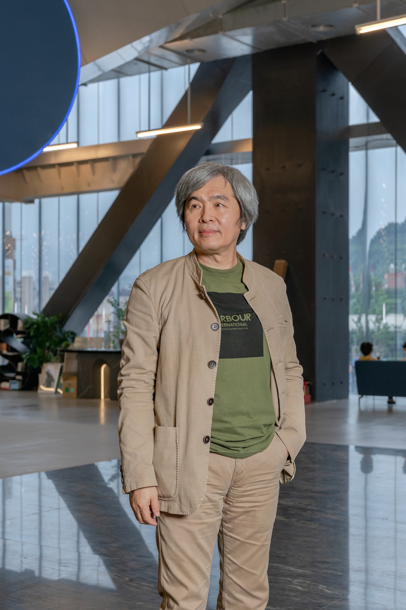 Austin Wang, CEO of Taipei Performing Arts Center, standing in the modern venue's interior