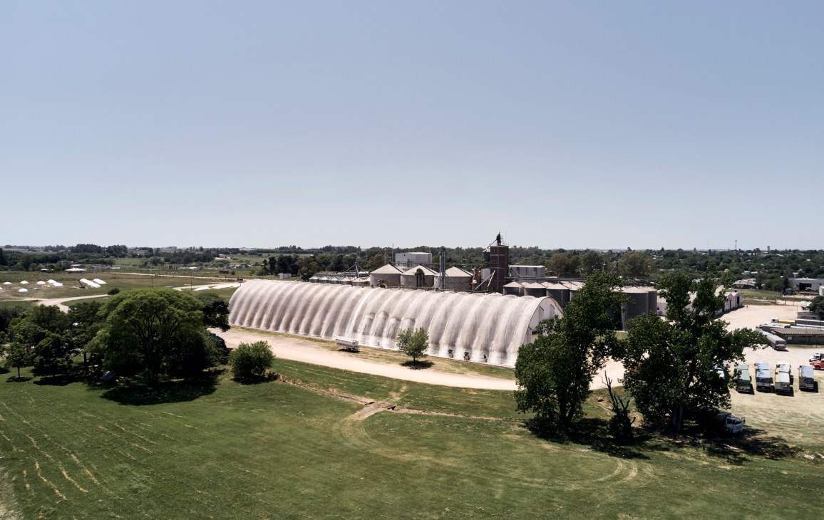 Large cylindrical concrete grain silo with geometric architectural details