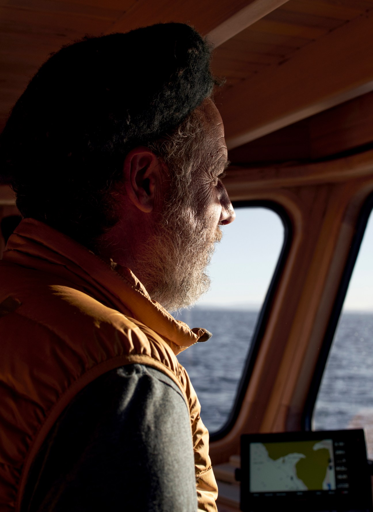 Architect Guillermo Acuña steering the restored Kon Tiki boat during a test voyage