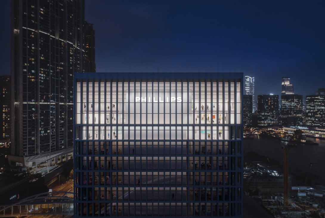 Modern glass office building illuminated at night in urban skyline
