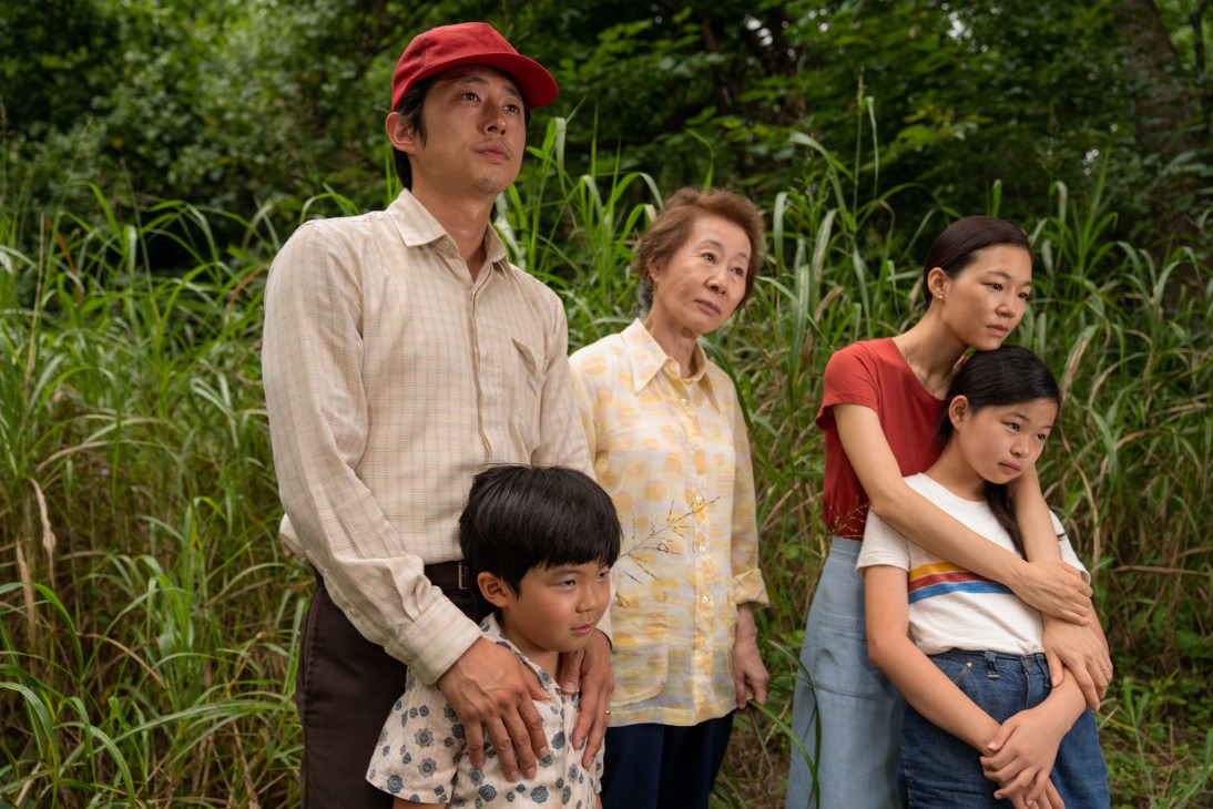 Family of five standing in a cornfield in rural Arkansas setting from the film Minari.