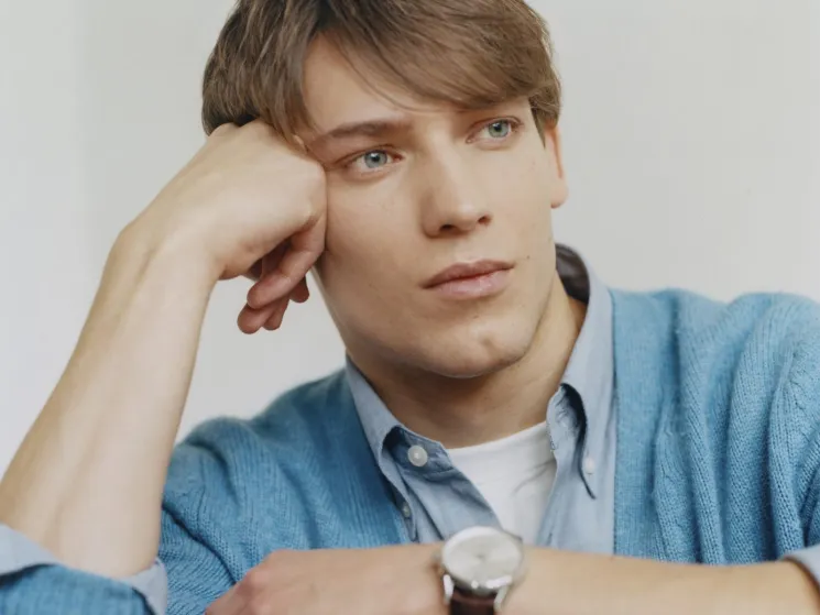 Model wearing jumper by Fursac, shirt and t-shirt by Uniqlo, with bag by Hermès and watch by Tag Heuer