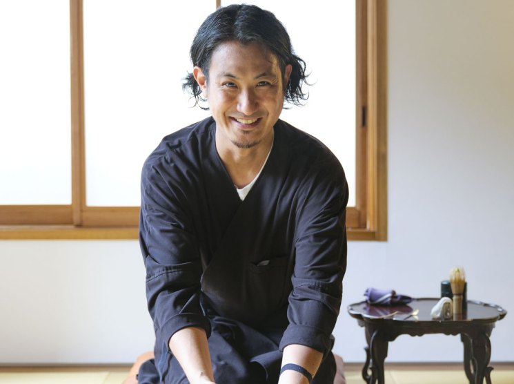 Yusuke Mori, butler at Trunk House inn in Tokyo, preparing tea in traditional Japanese room