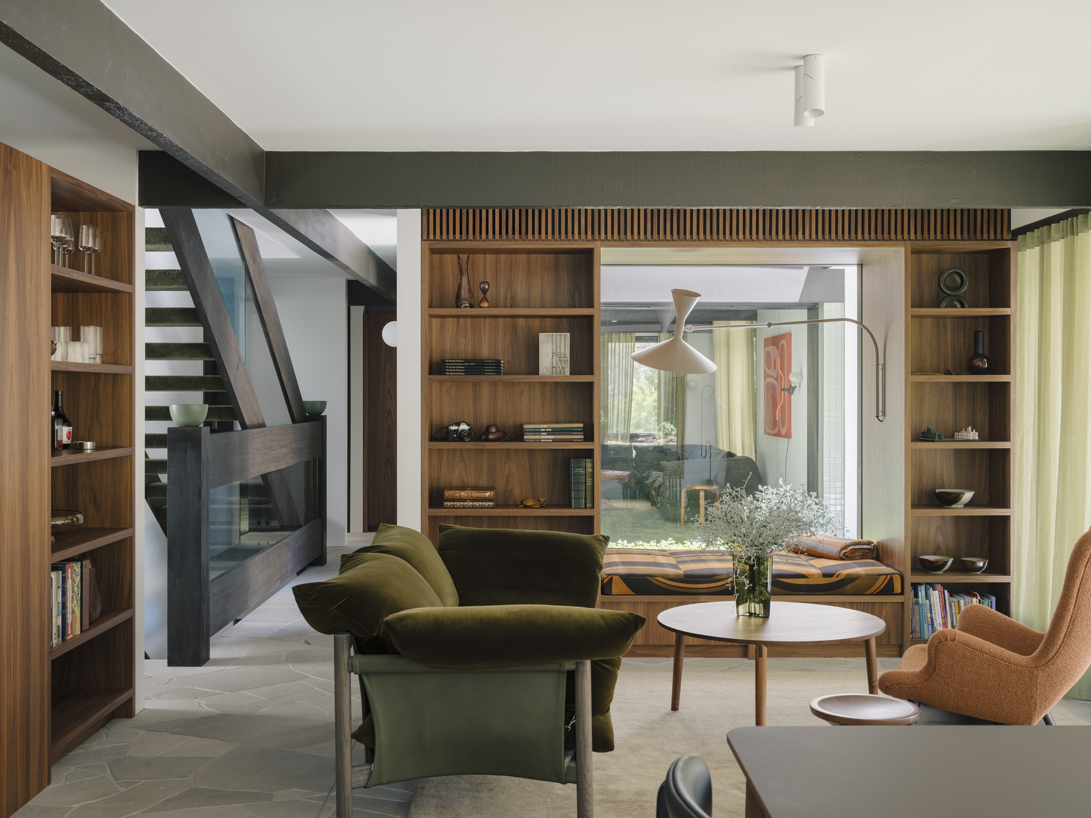 Living room with bespoke shelving and Le Corbusier lamp