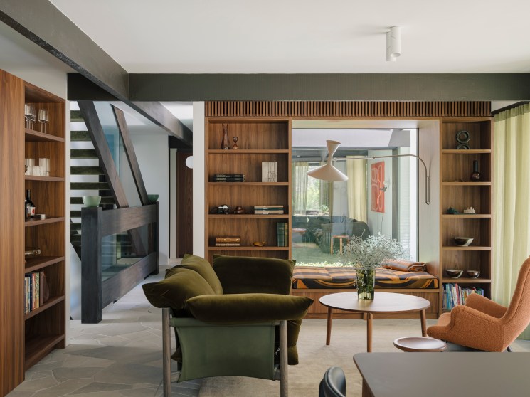 Living room with bespoke shelving and Le Corbusier lamp