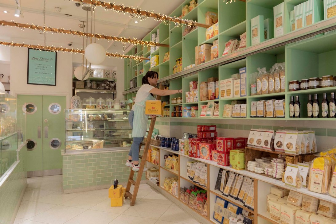 Historic Lina Stores storefront on Brewer Street with vintage green and white signage