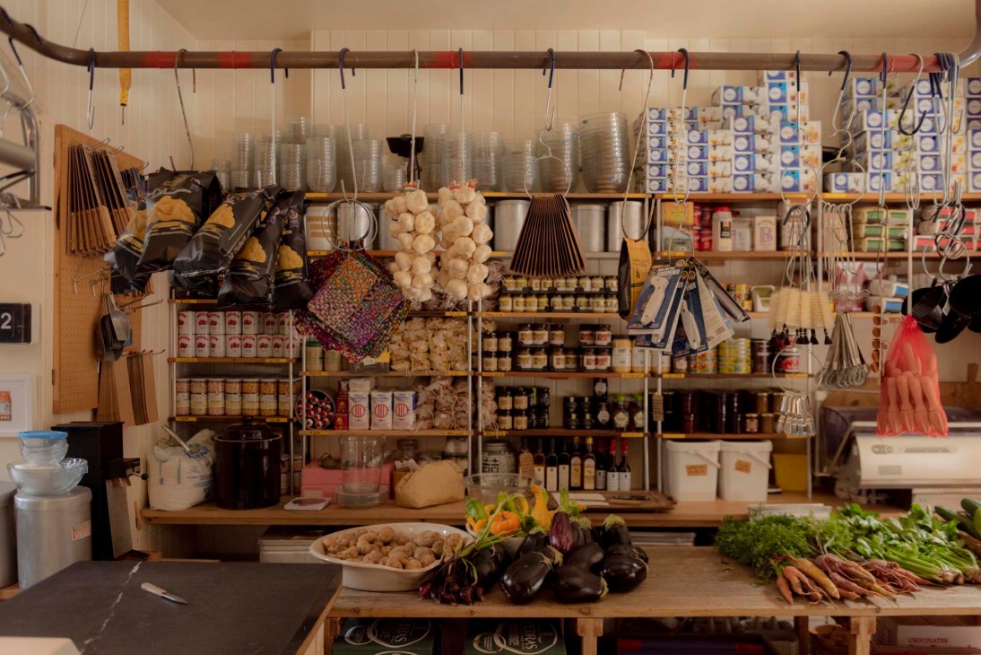 Interior of Leila's Shop showing fresh produce displays and natural lighting through large windows