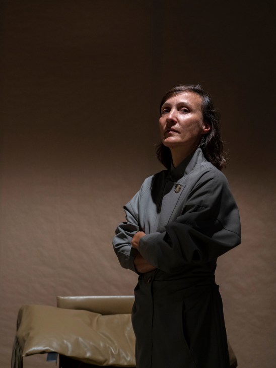 Amaryllis Jacobs, co-founder of Maniera gallery, standing in dark clothing with arms crossed