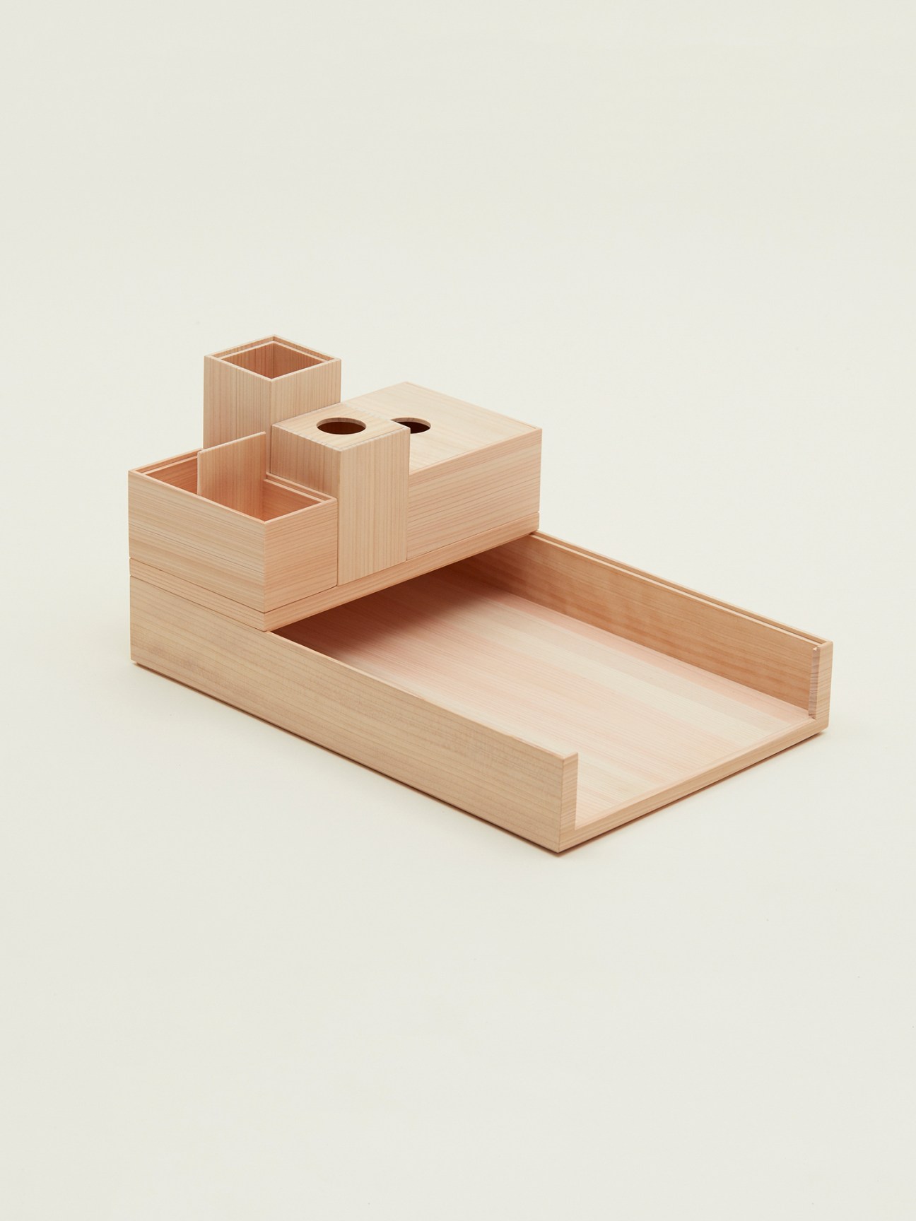 Hinoki-wood desk organiser by Monocle with compartments and pen holders.