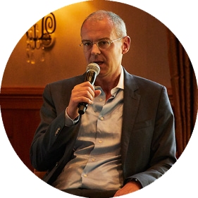 Dirk Effenberger, head investment risk at CIO GWM UBS, speaking at a conference with a microphone.