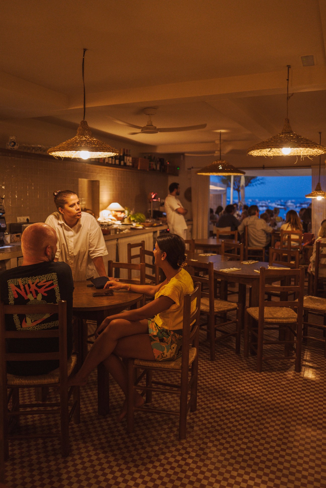 Interior dining area of Margarita restaurant in Calella with coastal ambiance