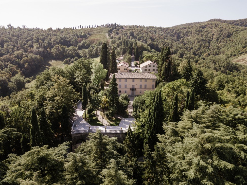 Aerial view of Roncolo 1888 bed-and-breakfast set among the gentle hills of the Venturini Baldini estate near Reggio Emilia