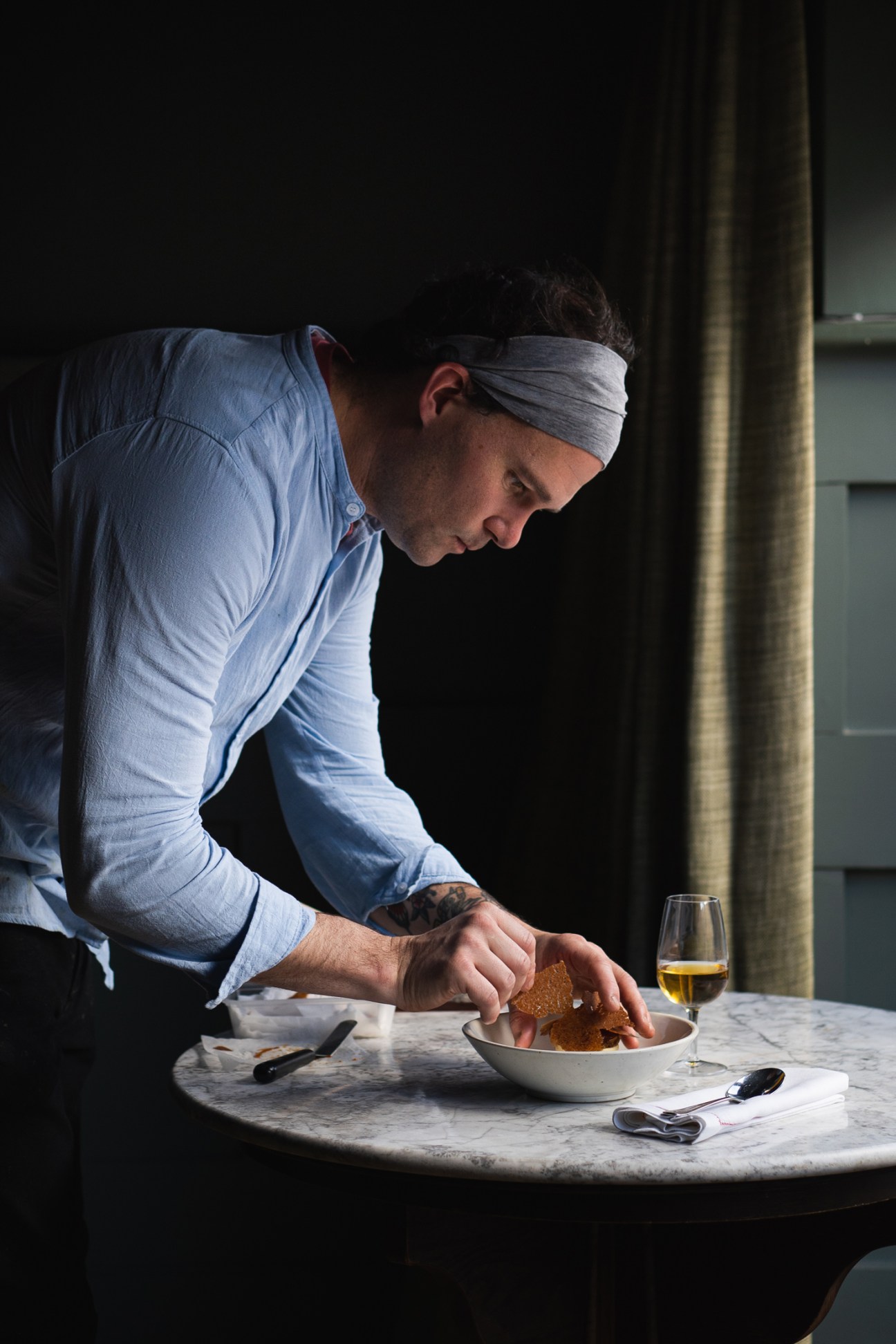 Head chef George Barson plating food at Beckford Canteen restaurant in Bath.