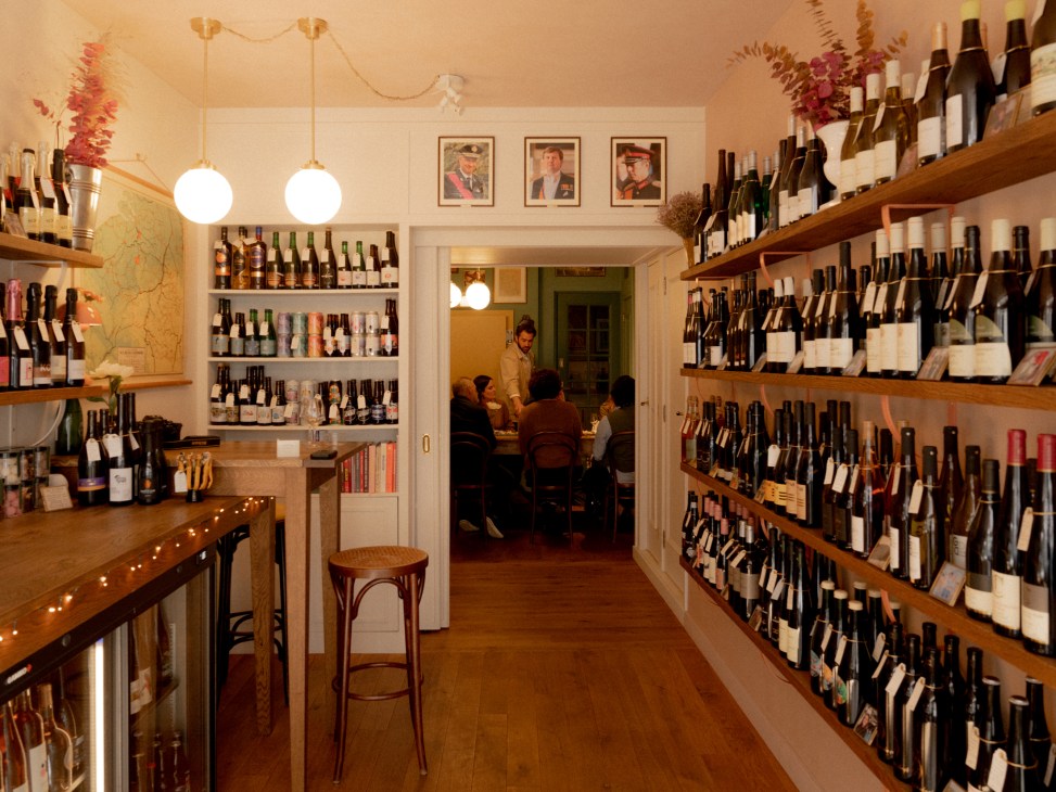 Wine and cheese tasting setup at Benelux Wine Co with local bottles and artisanal cheeses