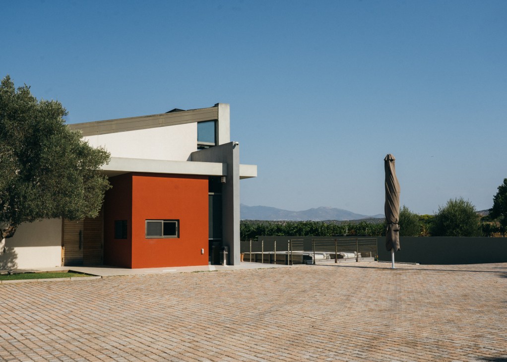 Exterior of Papagiannakos bioclimatic winery building with modern architecture