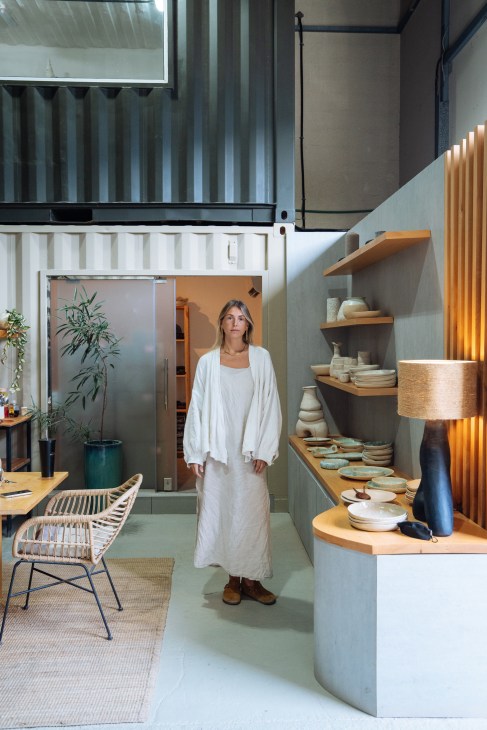 Nicole Farrelly posing in her ceramics shop, Cole & Cinder