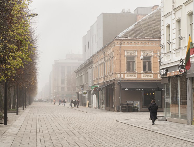 Morning fog on the tree-lined pedestrian boulevard of Laisves Aleja in Kaunas