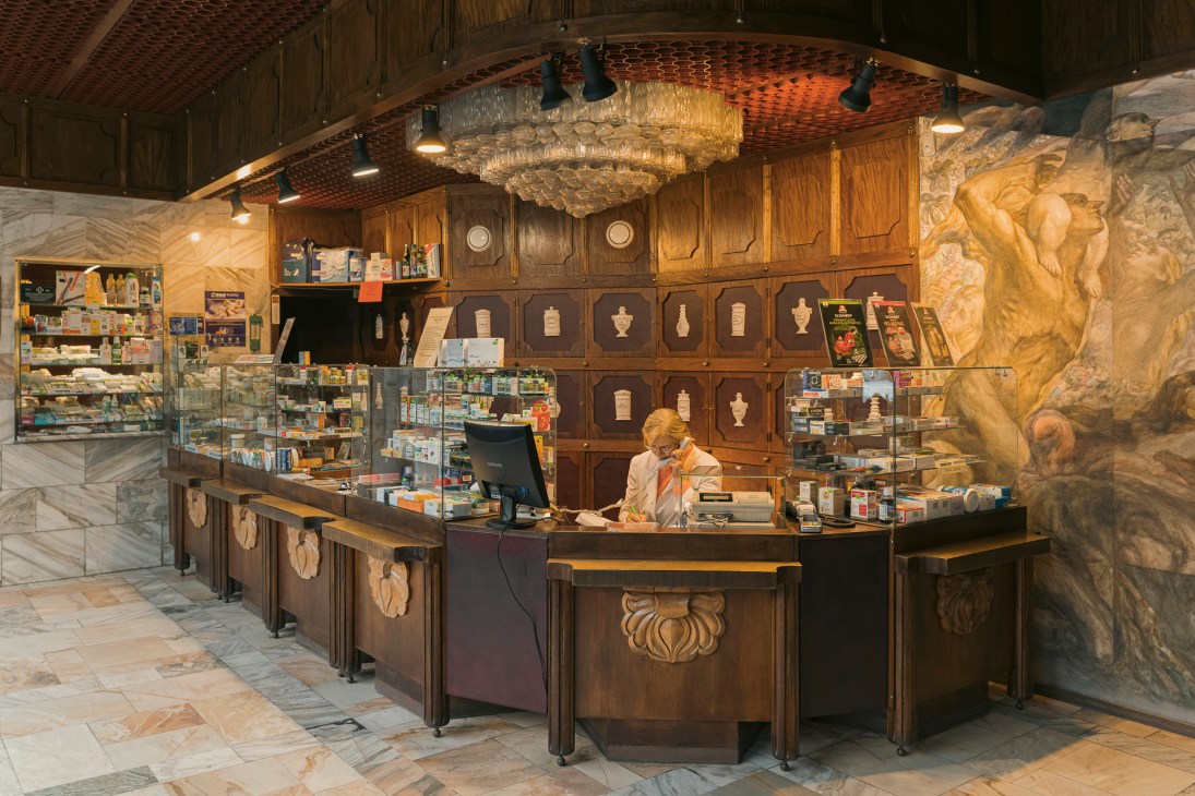 Storefront of the historic Vilties Vaistine pharmacy on Laisves Aleja with its original signage and display windows