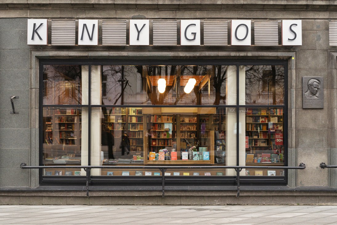 Interior view of Centrinis Knygynas bookshop showing book displays and period architecture
