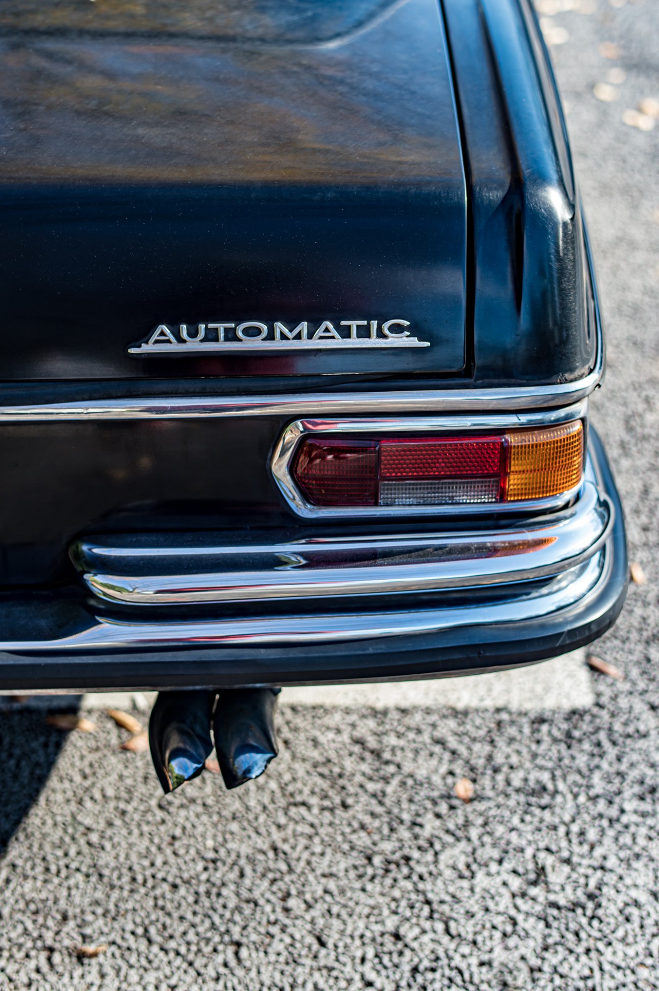 Interior view of 1970 Mercedes-Benz showing large steering wheel and vintage dashboard controls