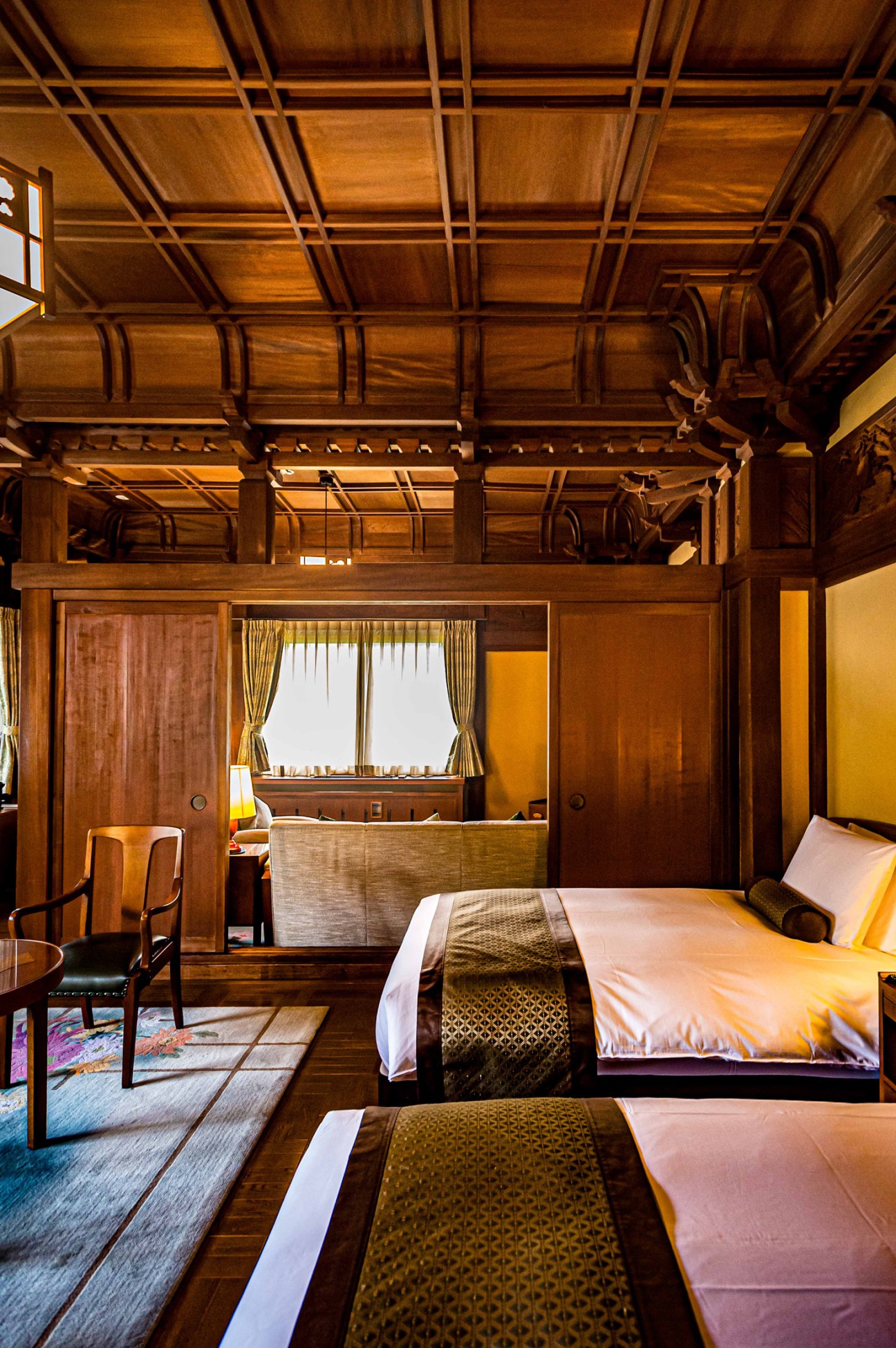 Well-made hotel bed at Fujiya Hotel with crisp white linens and traditional Japanese attention to detail