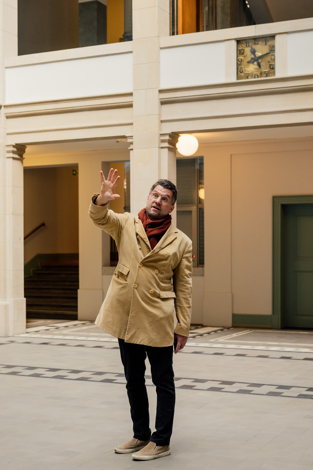 Samuel Leuenberger standing by Basel's Rhine river during a city walk
