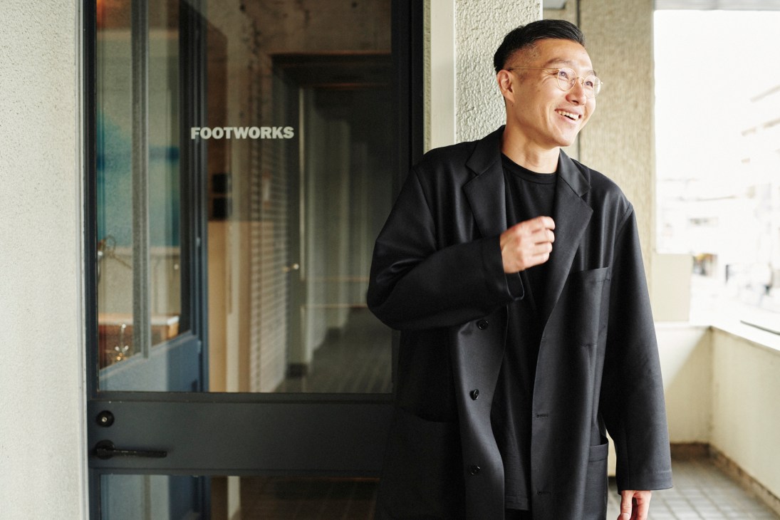 Takeshi Mori in his workshop examining handmade leather sandals and orthopaedic insoles