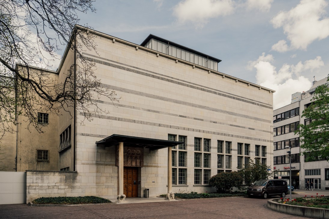 Interior architectural space with stone balconies and glass ceiling in Basel's construction department