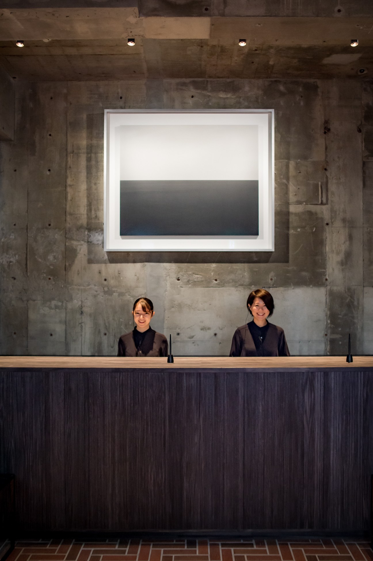 Reception desk with seascape piece by Hiroshi Sugimoto