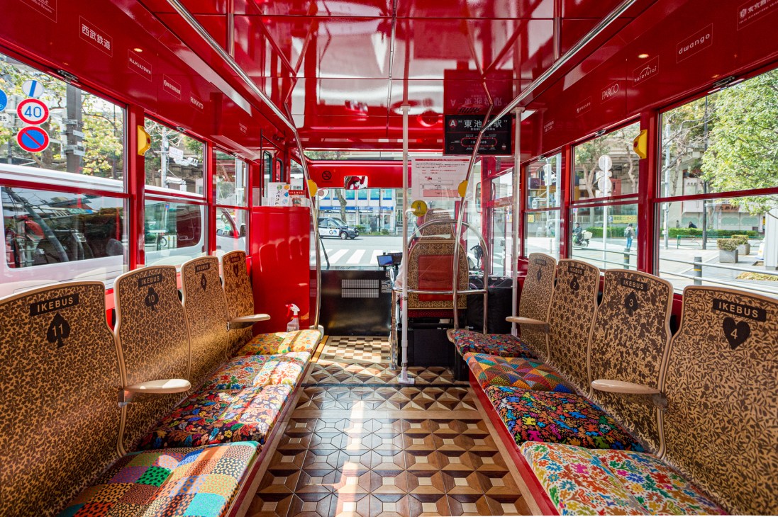Interior of Ikebus showing custom parquet flooring and designed textile seating