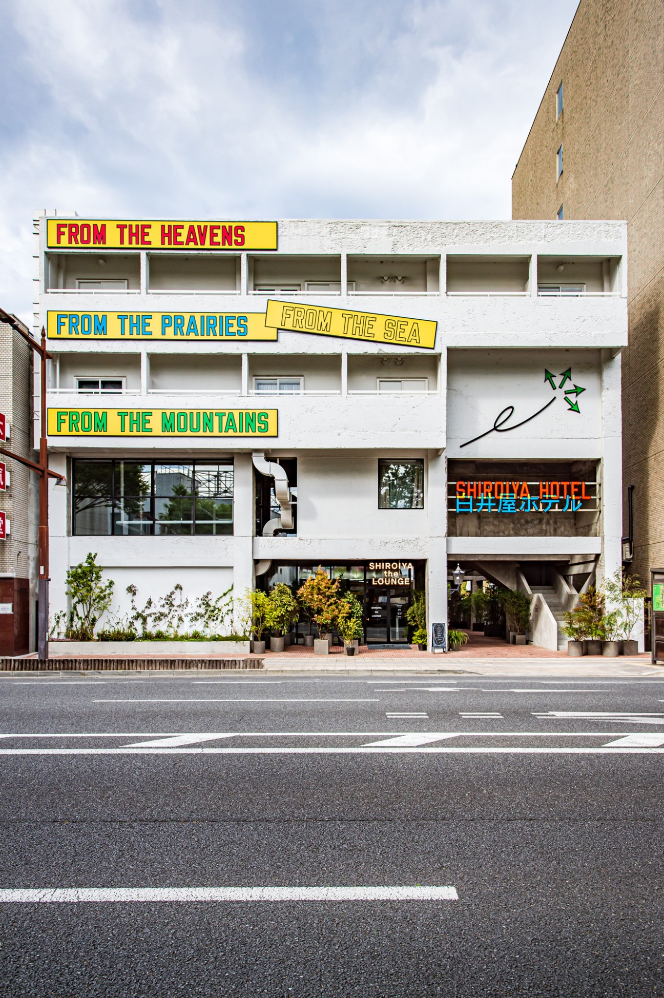 Exterior of the Shiroiya Hotel with artwork by Lawrence Weiner
